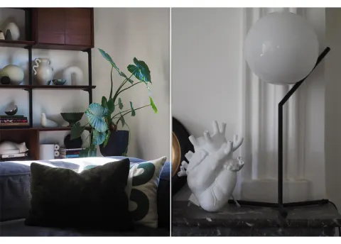 bitkiler ve heykelsi aydınlatma ile sıcak oturma odası